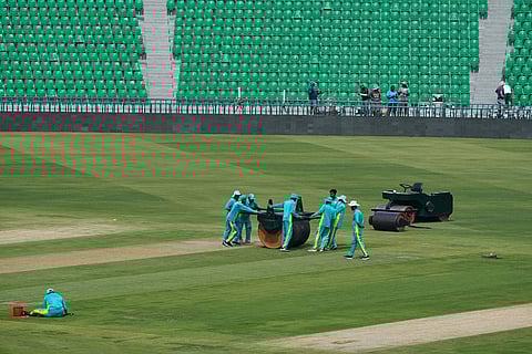 Groundsmen work at the at the Gaddafi Stadium in preparations for upcoming Pakistan's premier domestic T20 the Pakistan Super League, which will take place in empty stadiums due to the recent spike in oil prices, in Lahore, Pakistan.