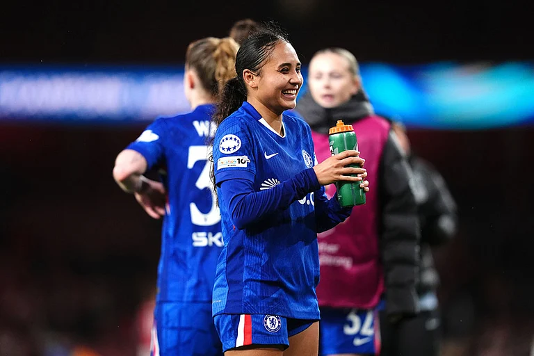 Chelsea's Alyssa Thompson smiles after the Women's Champions League soccer match between Arsenal and Chelsea in London. - | Photo: John Walton/PA via AP