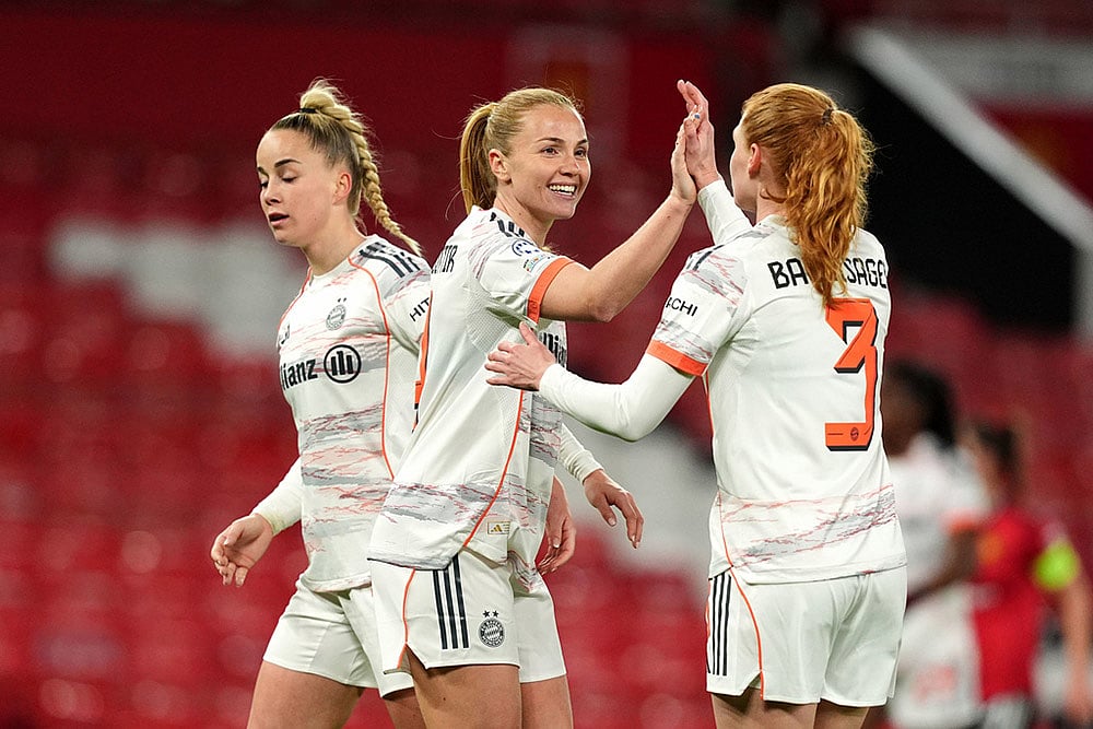 Bayern Munich's Glodis Viggosdottir, center, and teammates celebrate following victory during the Women's Champions League match between Manchester United and Bayern Munich, in Manchester, England. - | Photo: Martin Rickett/PA via AP