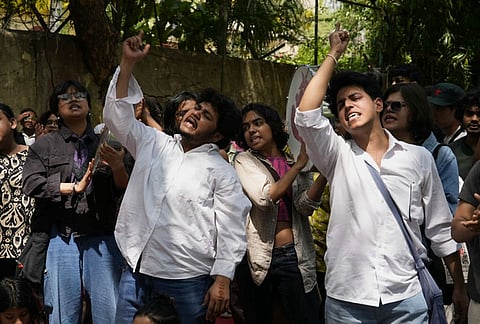 Supporters of the LGBTQIA+ community hold placards during a protest against the passage of the Transgender Persons (Protection of Rights) Amendment Bill, 2026, at Jantar Mantar in New Delhi.