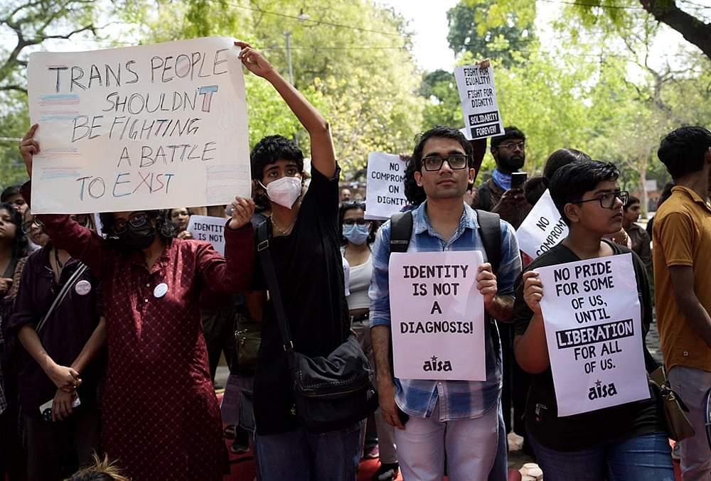 Supporters of the LGBTQIA+ community hold placards during a protest against the passage of the Transgender Persons (Protection of Rights) Amendment Bill, 2026, at Jantar Mantar in New Delhi. - | Photo: Vikram Sharma/Outlook