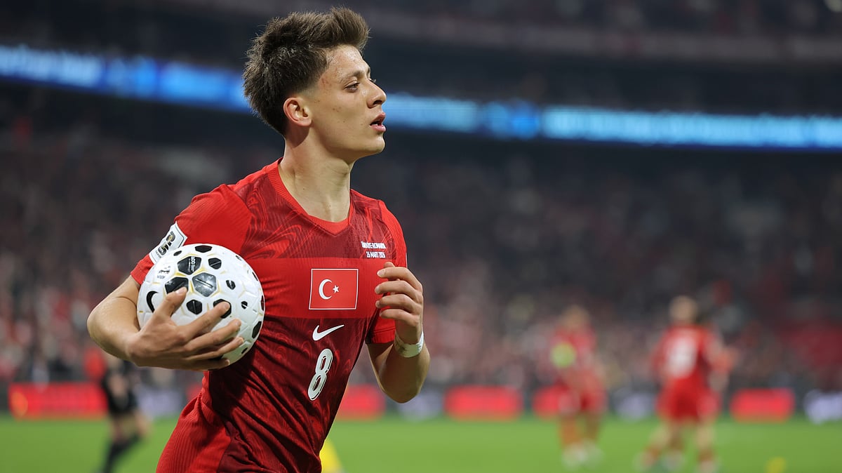 Turkey's Arda Guler grabs the ball during the 2026 World Cup playoff semifinal soccer match between Turkey and Romania, in Istanbul, Turkey, Thursday, March 26, 2026 - (AP Photo)