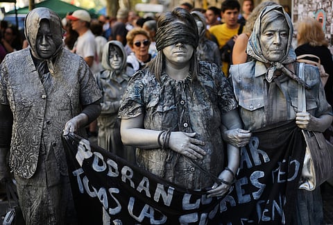 Activists demonstrate during a rally on the anniversary of the coup that brought the military regime (1976-1983) to power, in Buenos Aires, Argentina.