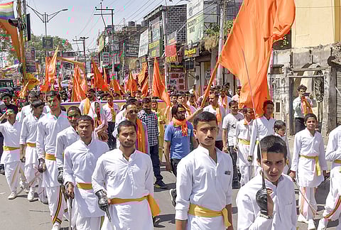 Devotees take part in a religious procession organised by Veer Savarkar Organization during the ‘Rama Navami’ festival, in Dehradun.