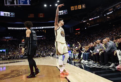 Golden State Warriors forward Gui Santos (15) celebrates after scoring during the second half of an NBA basketball game against the Brooklyn Nets in San Francisco.