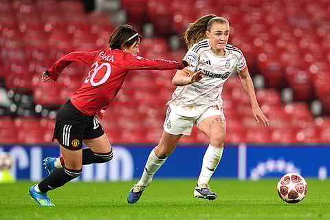 Bayern Munich's Georgia Stanway, right, and Manchester United's Hinata Miyazawa battle for the ball during the Women's Champions League match between Manchester United and Bayern Munich in Manchester, England.