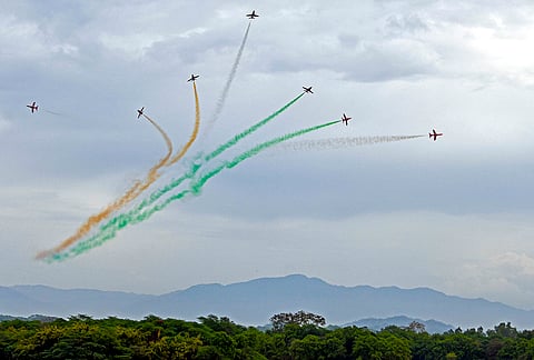 Indian Air Force's (IAF) Surya Kiran Aerobatic Team (SKAT) performs manoeuvres during an air show, near Sukhna Lake in Chandigarh.