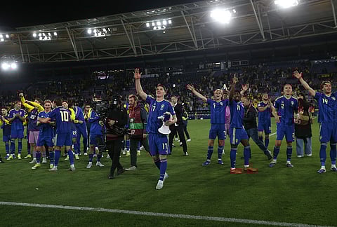 Sweden players greet fans at the end of the World Cup playoff semifinal soccer match between Ukraine and Sweden in Valencia, Spain.