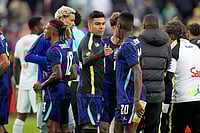 | Photo: AP/Charles Krupa : Brazil's Casemiro, center, greets teammate Luiz Henrique as he leaves the field after the international friendly soccer match between Brazil and France in Foxborough, Mass.