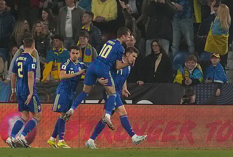 Sweden's Viktor Gyokeres celebrates with teammates after scoring the opening goal during a World Cup playoff semifinal soccer match between Ukraine and Sweden in Valencia, Spain.