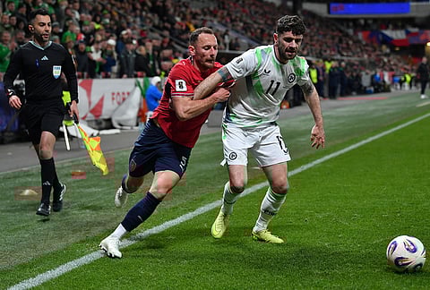 Czech Republic's Vladimír Coufal, left, and Ireland's Robbie Brady fight for the ball during a World Cup playoff semifinal soccer match between the Czech Republic and Ireland in Prague, Czech Republic.