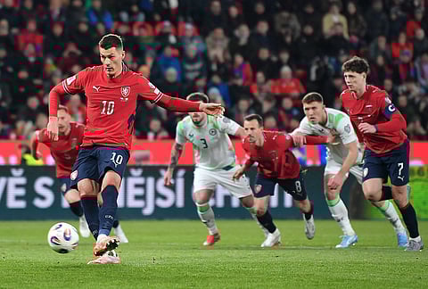 Czech Republic's Patrik Schick scores from a penalty kick during a World Cup playoff semifinal soccer match between the Czech Republic and Ireland in Prague, Czech Republic.