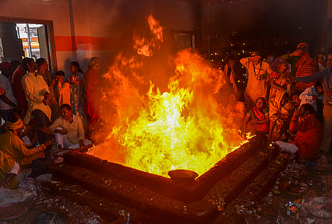 People perform rituals at the 'Vindhyavasini temple' on the last day of the 'Navaratri' festival, in Mirzapur, Uttar Pradesh.