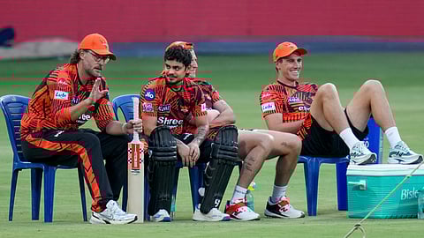 Sunrisers Hyderabad's coach Daniel Vettori, left, captain Ishan Kishan, second left, and others during a practice session on the eve of the Indian Premier League 2026 cricket match against Royal Challengers Bengaluru, at M Chinnaswamy Stadium.