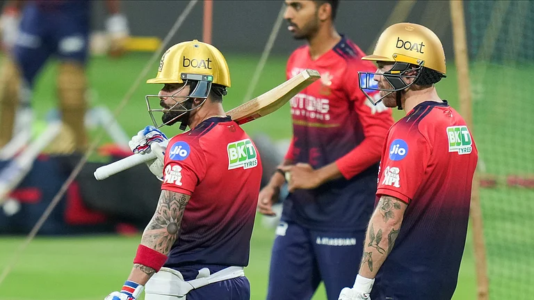 Royal Challengers Bengaluru's Virat Kohli, left, and Phil Salt, right, during a practice session ahead of their Indian Premier League 2026 match against Sunrisers Hyderabad, at M. Chinnaswamy Stadium in Bengaluru. - PTI/Shailendra Bhojak