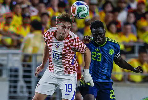 Croatia midfielder Toni Fruk (19) and Colombia forward Luis Díaz (23) head the ball during the second half of an international friendly soccer game, in Orlando, Florida.