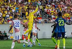 | Photo: AP/Kevin Kolczynski : Croatia goalkeeper Dominik Livakovic, center, punches the ball away from the goal during the second half of an international friendly soccer game in Orlando, Florida.