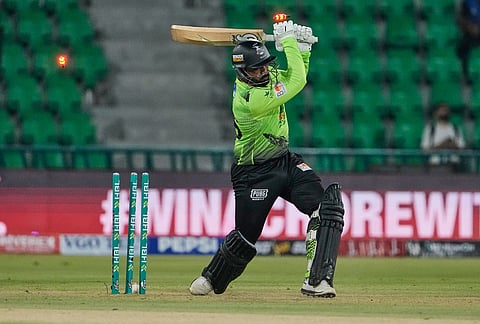 Lahore Qalandars' Asif Ali is bowled out by Hyderabad Kingsmen Mohammad Ali during the opening cricket match of the Pakistan Super League between Lahore Qalandars and Hyderabad Kingsmen, which taking place without spectators, in Lahore, Pakistan.