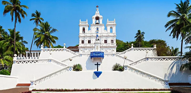 White Baroque church in Goa with zigzag stairs