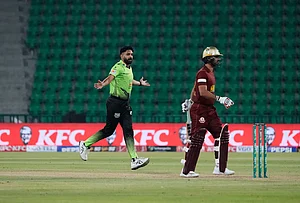 | Photo: AP/K.M. Chaudary : Lahore Qalandars' Haris Rauf, left, celebrates after taking the wicket of Hyderabad Kingsmen Hassan Khan, right, during the opening cricket match of the Pakistan Super League between Lahore Qalandars and Hyderabad Kingsmen, which taking place without spectators, in Lahore, Pakistan.