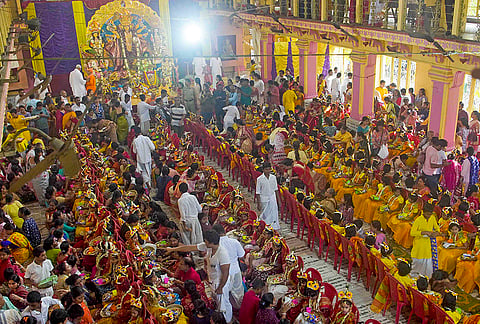 Young girls sit during the 'Kanya Pujan' ritual on the last day of the 'Nava Ratri' festival, at 'Dakshineswar Ramkrishna Sangha Adyapeath' temple, in Kolkata, West Bengal. 
