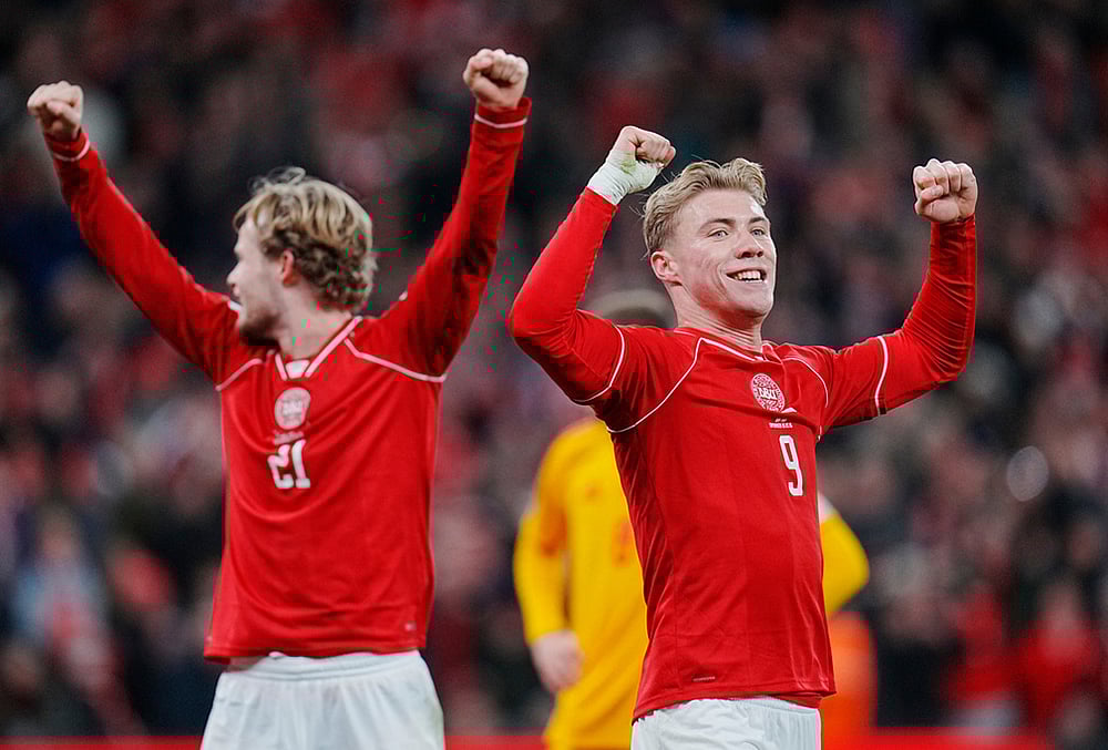 Denmark's Morten Hjulmand, left, and Rasmus Hojlund celebrate during the World Cup playoff semifinal soccer match between Denmark and North Macedonia in Copenhagen.  - | Photo: Liselotte Sabroe/Ritzau Scanpix via AP