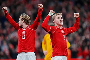 | Photo: Liselotte Sabroe/Ritzau Scanpix via AP : Denmark's Morten Hjulmand, left, and Rasmus Hojlund celebrate during the World Cup playoff semifinal soccer match between Denmark and North Macedonia in Copenhagen.