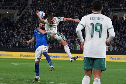 Northern Ireland's Jamie Donley, right, and Italy's Manuel Locatelli vie for the ball during the World Cup qualifying play-off soccer match between Italy and Northern Ireland, in Bergamo, Italy.