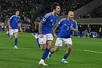 | Photo: AP/Antonio Calanni : Italy's Federico Dimarco, right, celebrates with teammate Sandro Tonali who scored his side's first goal during the World Cup qualifying play-off soccer match between Italy and Northern Ireland, in Bergamo, Italy.
