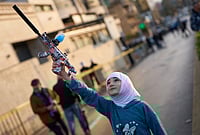 | Photo: AP/Emilio Morenatti : A girl holds a toy gun during a protest outside Iran's embassy, where dozens of people gathered waving Hezbollah and Iranian flags in solidarity with the Islamic Republic, in Beirut, Lebanon.
