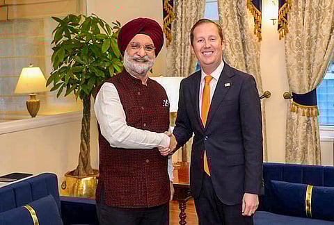 Delhi LG Taranjit Singh Sandhu, left, exchanges a handshake with US Ambassador to India Sergio Gor, in New Delhi. 