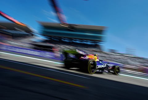 Red Bull driver Isack Hadjar of France drives out of his team garage during the first practice session of the Japanese Formula One Grand Prix in Suzuka, Japan.