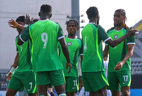Nigeria's Akor Adams, left, celebrates with teammates after scoring his side's second goal during a friendly soccer match between Iran and Nigeria in Antalya, southern Turkey.