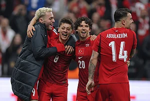 | Photo: AP : Turkey's players celebrate at the end of the 2026 World Cup playoff semifinal soccer match between Turkey and Romania, in Istanbul, Turkey.