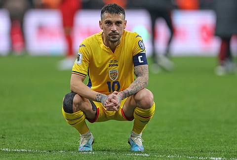 Romania's Nicolae Stanciu look dejected at the end of the 2026 World Cup playoff semifinal soccer match between Turkey and Romania, in Istanbul, Turkey.
