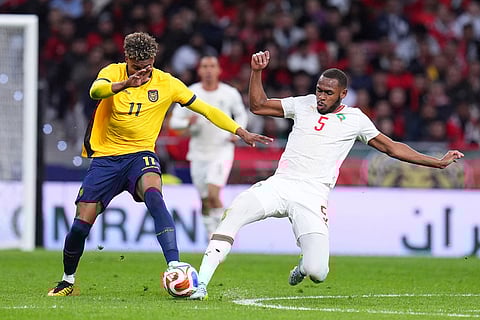 Ecuador's Kevin Rodriguez, left, and Morocco's Issa Diop fight for the ball during a friendly soccer match between Morocco and Ecuador in Madrid, Spain.