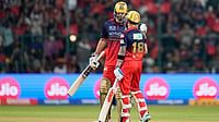 (AP Photo/Aijaz Rahi) : Royal Challengers Bengaluru's Virat Kohli, right, celebrates his fifty runs with batting partner Tim David during the Indian Premier League cricket match between Royal Challengers Bengaluru and Sunrisers Hyderabad in Bengaluru, India, Saturday, March 28, 2026