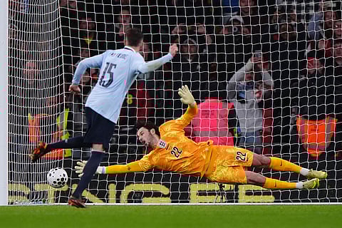 England goalkeeper James Trafford dives in vain as Uruguay's Federico Valverde scores his side's first goal during the international friendly soccer match between England and Uruguay in London.