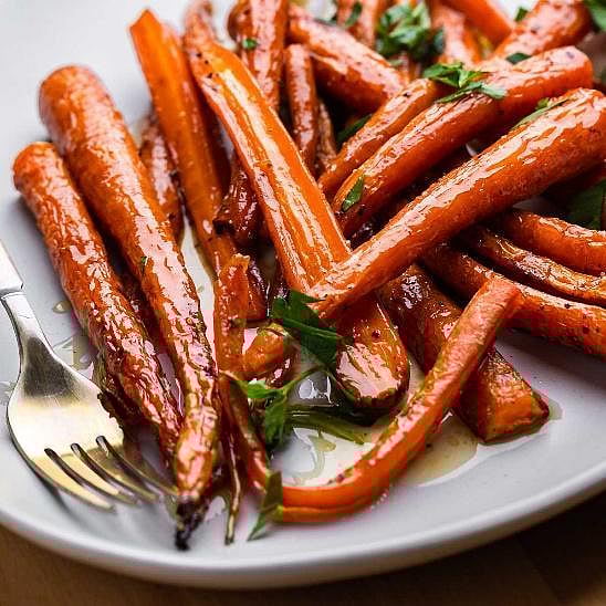 Maple roasted carrots with parsley and a fork