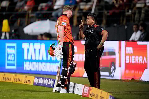 Sunrisers Hyderabad's Heinrich Klaasen, left, unhappy with the third umpire's decision for his wicket, has a word with the fourth umpire during the Indian Premier League cricket match between Royal Challengers Bengaluru and Sunrisers Hyderabad in Bengaluru, India, Saturday, March 28, 2026. 