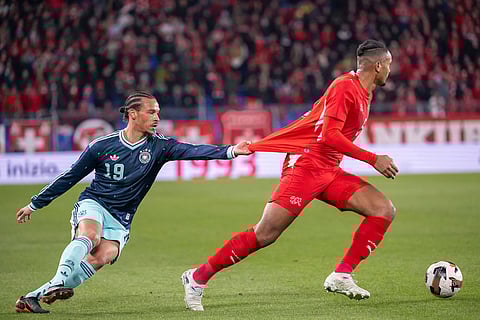 Germany's Leroy Sane, left, against Switzerland's Manuel Akanji, right, during an international friendly soccer match between Switzerland and Germany in Basel, Switzerland.