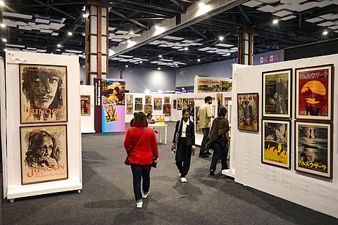 People visit an exhibition at the International Film Festival Delhi (IFFD) 2026, at Bharat Mandapam, in New Delhi.