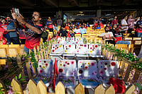 Photo: AP/Aijaz Rahi : Flowers are placed on 11 seats kept at M Chinnaswamy Stadium as a tribute to eleven Royal Challengers Bengaluru fans who lost their lives in a stampede last year, as spectators wait for the Indian Premier League cricket match between Royal Challengers Bengaluru and Sunrisers Hyderabad to begin in Bengaluru, India.