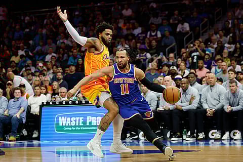 New York Knicks guard Jalen Brunson (11) drives the baseline against Charlotte Hornets forward Miles Bridges during the first half of an NBA basketball game in Charlotte, N.C.