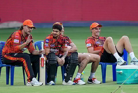 Sunrisers Hyderabad’s coach Daniel Vettori, left, captain Ishan Kishan, second left, and others during a practice session on the eve of the Indian Premier League (IPL) 2026 cricket match against Royal Challengers Bengaluru, at M Chinnaswamy Stadium in Bengaluru, Karnataka.