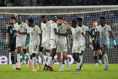 Mauritania's Jordan Lefort (21) celebrates scoring his side's opening goal against Argentina during a friendly soccer match in Buenos Aires, Argentina.