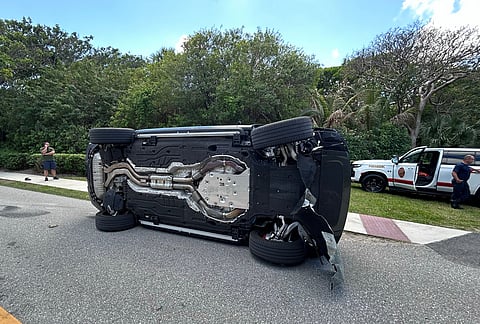 This photo provided by the Martin County Sheriff's Office shows the overturned vehicle in a rollover crash which involved Tiger Woods in Jupiter Island, Florida.