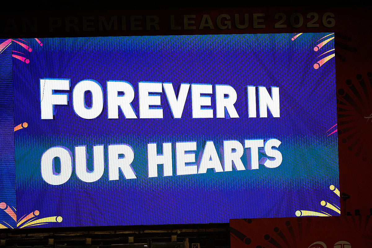 A signboard at M Chinnaswamy Stadium displays a tribute to 11 Royal Challengers Bengaluru fans who lost their lives in a stampede last year, as spectators wait for the Indian Premier League cricket match between Royal Challengers Bengaluru and Sunrisers Hyderabad to begin, in Bengaluru, India, Saturday, March 28, 2026. 