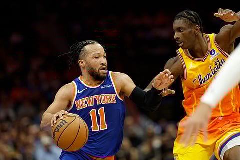 New York Knicks guard Jalen Brunson (11) drives against Charlotte Hornets forward Moussa Diabate, right, during the first half of an NBA basketball game in Charlotte, N.C.