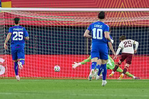 Spain's Victor Munoz, right, scores his side's third goal during the international friendly soccer match between Spain and Serbia in Villarreal, Spain.